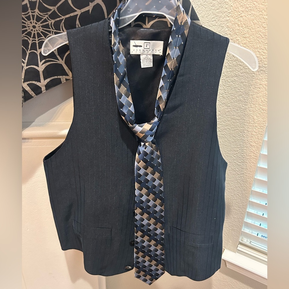 Elegant Black Pinstripe Vest with Geometric Tie